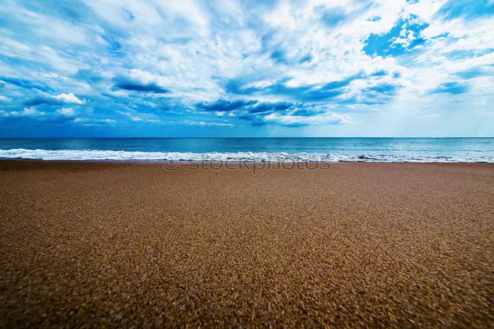 Similar – Image, Stock Photo Endless beach at Rainbow Beach. Walk left at the beach. A car is approaching. In the background a medium high mountain.