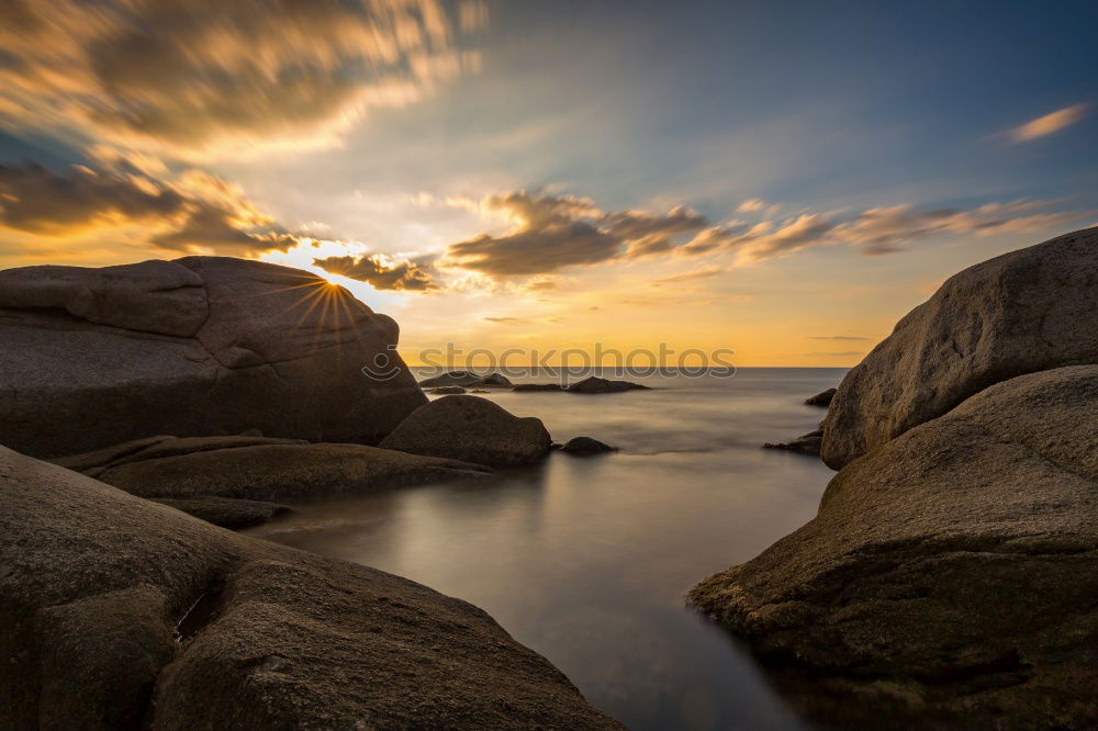 Similar – Image, Stock Photo Liapades Beach, evening atmosphere on a stony beach, waves breaking on a rock behind which the sun is setting