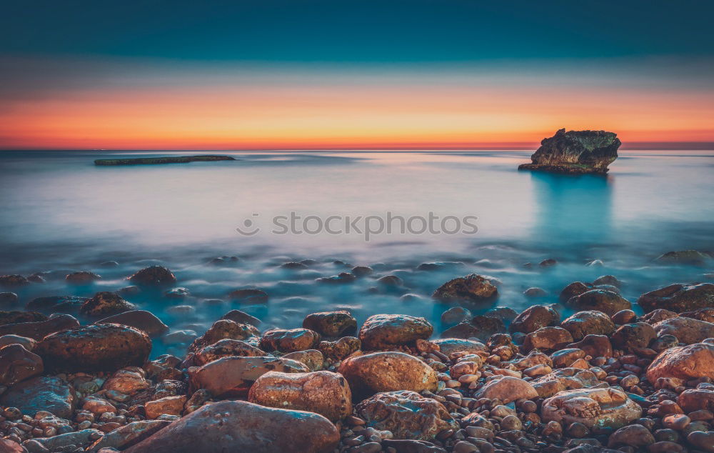 Similar – Rocky coast in the morning light