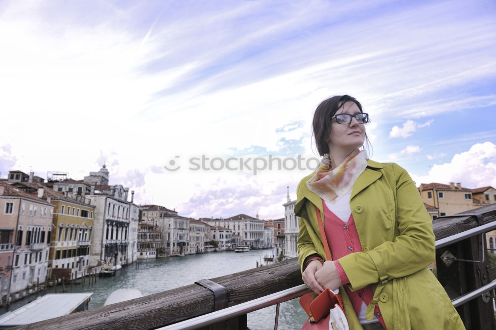 Similar – Stylish woman sitting near bridge in old city