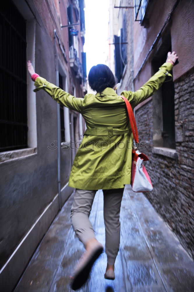 Similar – Happy man jumping wearing winter clothes in the street