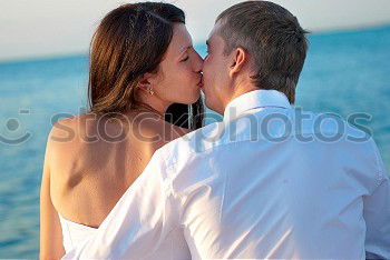 Similar – Image, Stock Photo Embracing loving couple on beach