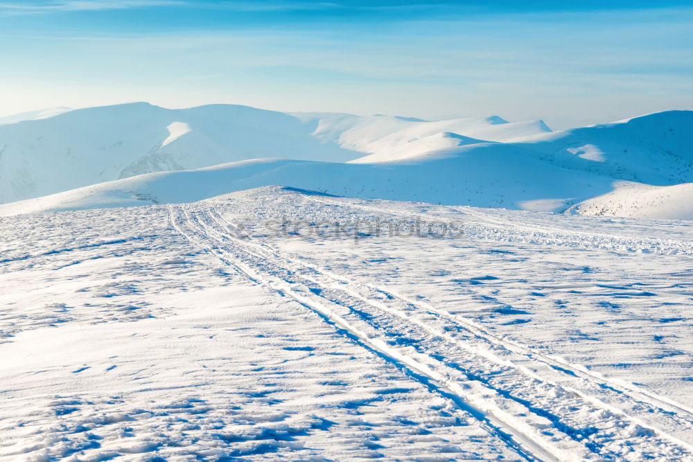 Similar – Two people in beautiful winter mountains