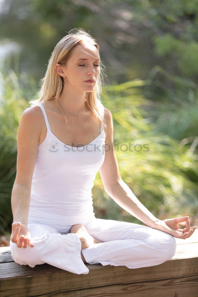 Similar – Image, Stock Photo Young woman doing yoga on wooden road in nature