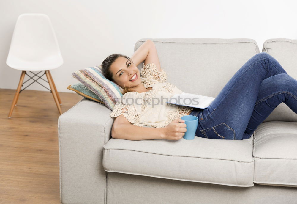 Similar – woman with laptop on her sofa at home