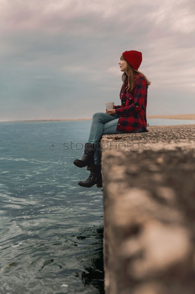 Similar – Image, Stock Photo Young woman is taking picture of sunset at the beach