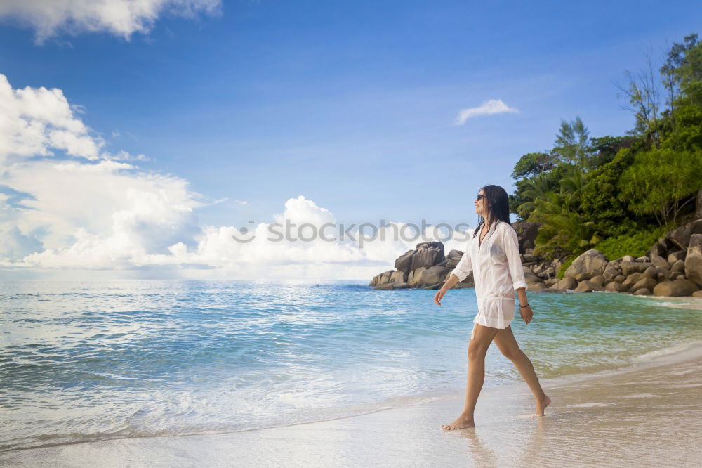 Similar – Image, Stock Photo Woman walking on sand shore near water