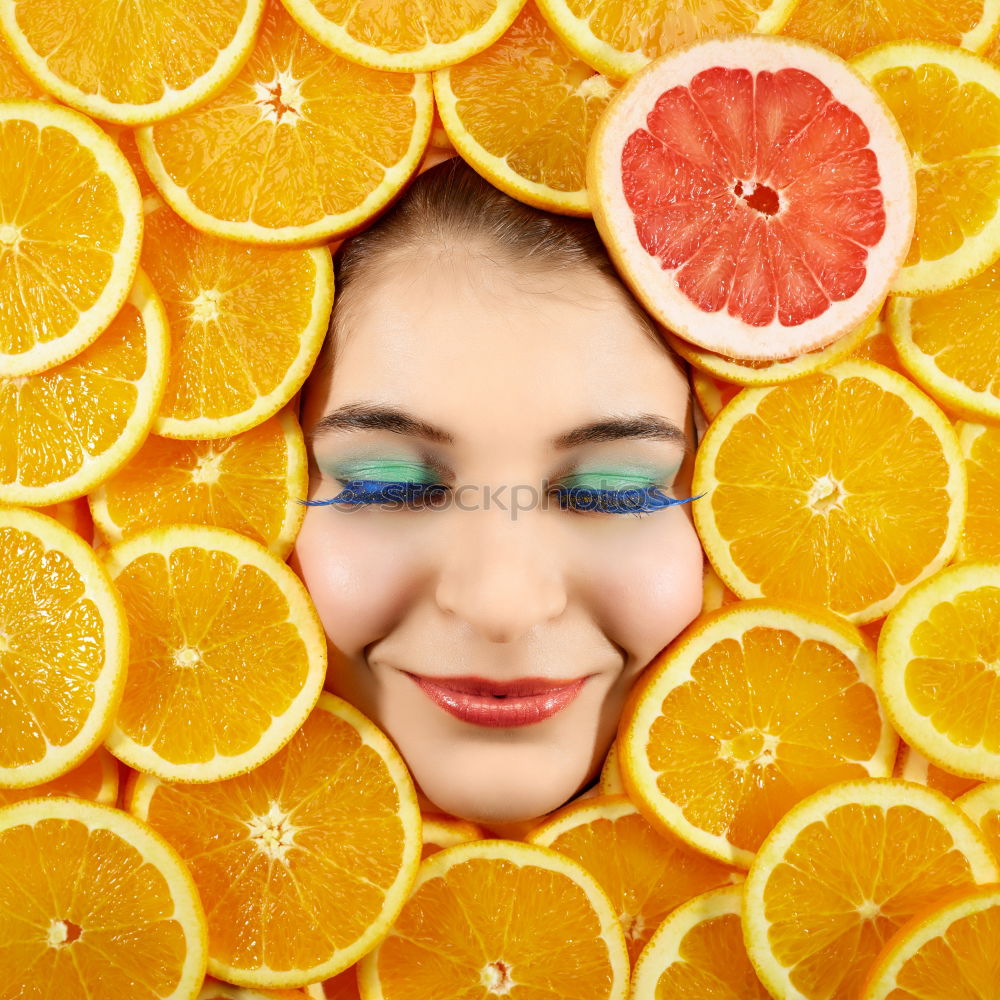 Similar – Smiling woman between slices of orange