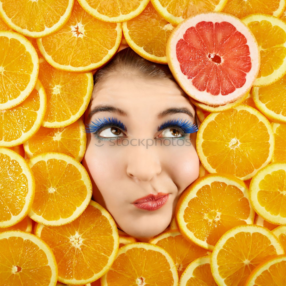 Similar – Smiling woman between slices of orange