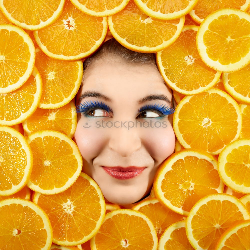 Similar – Smiling woman between slices of orange