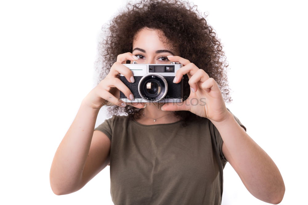 Similar – Close up of a photographer with her camera.