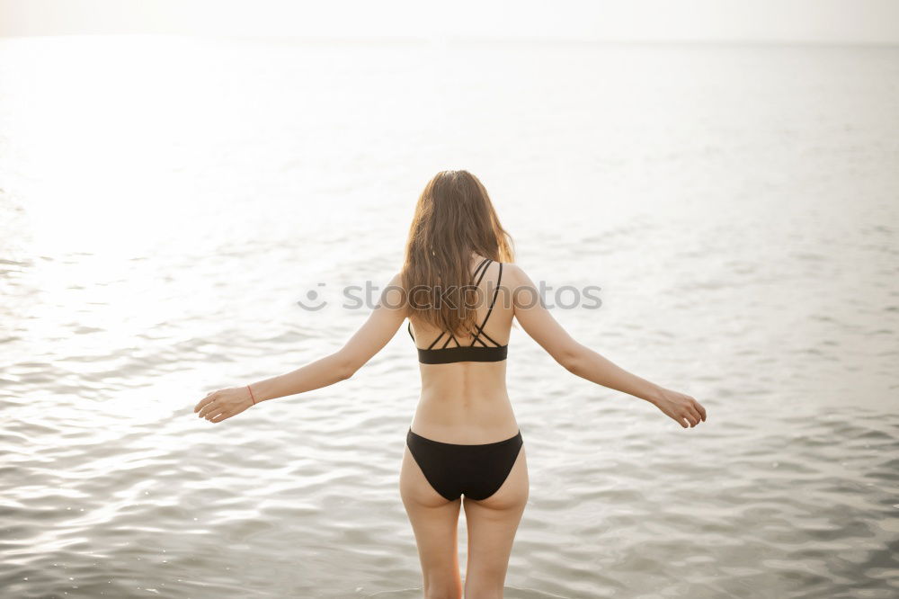 Similar – Image, Stock Photo Young Woman is having a good time at the beach