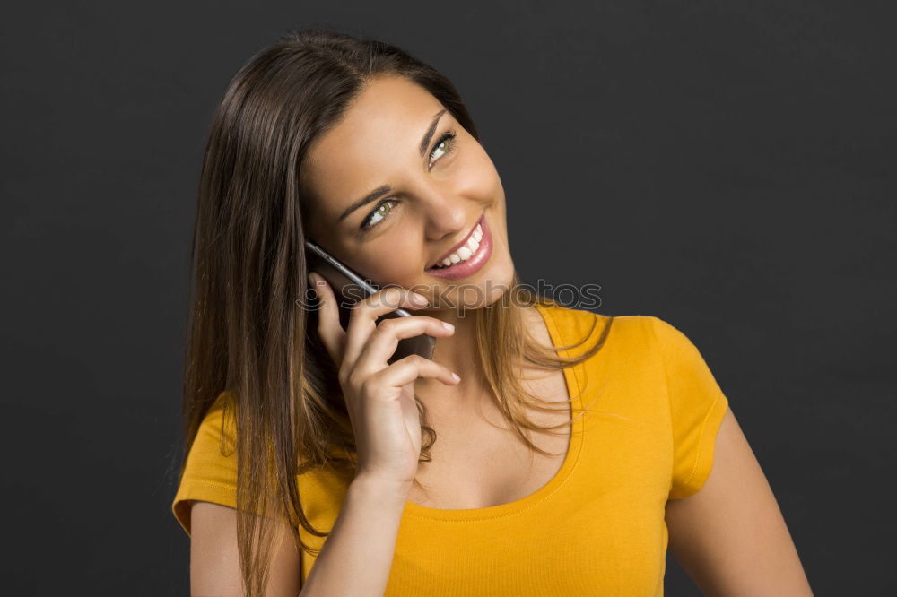 Smiling Woman in Autumn Fashion Talking on Phone