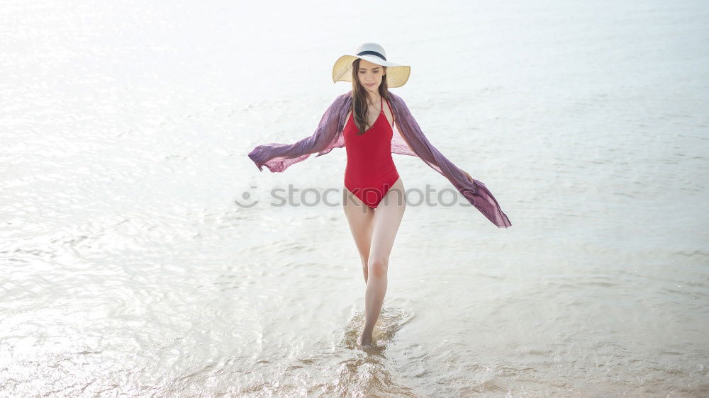 Similar – Cheerful girl posing in life vest