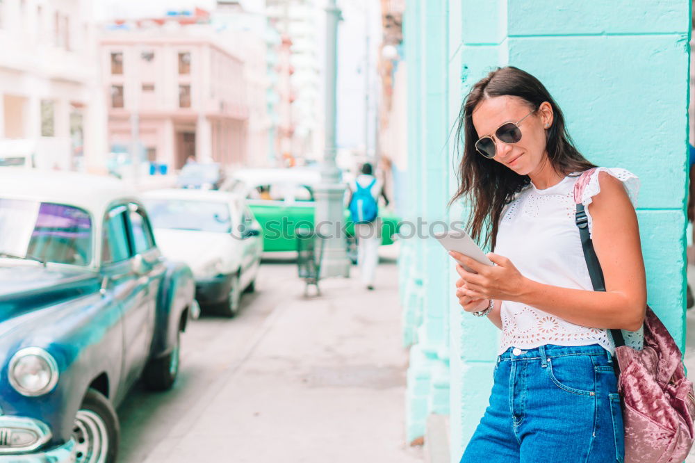 Similar – Image, Stock Photo Back view rear view of a woman holding shopping bags while wearing cool style cloths. Jeans and a top. Shopping street. Changing and buying gifts concept.