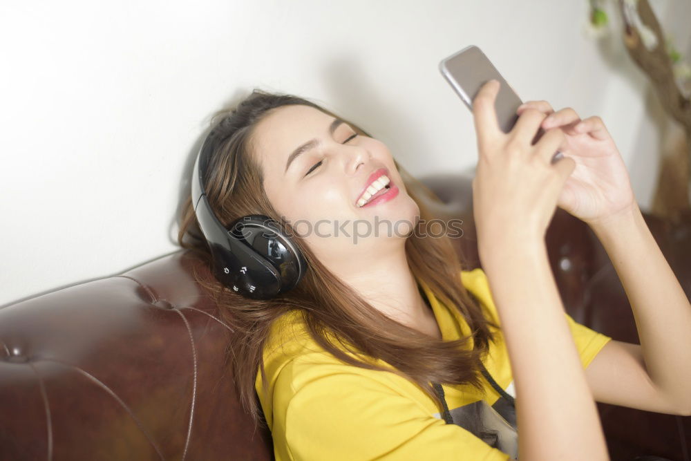 Similar – Image, Stock Photo Top shot of brother and sister listening to music together from smartphones