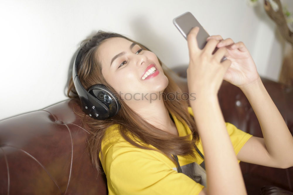 Similar – Image, Stock Photo Top shot of brother and sister listening to music together from smartphones