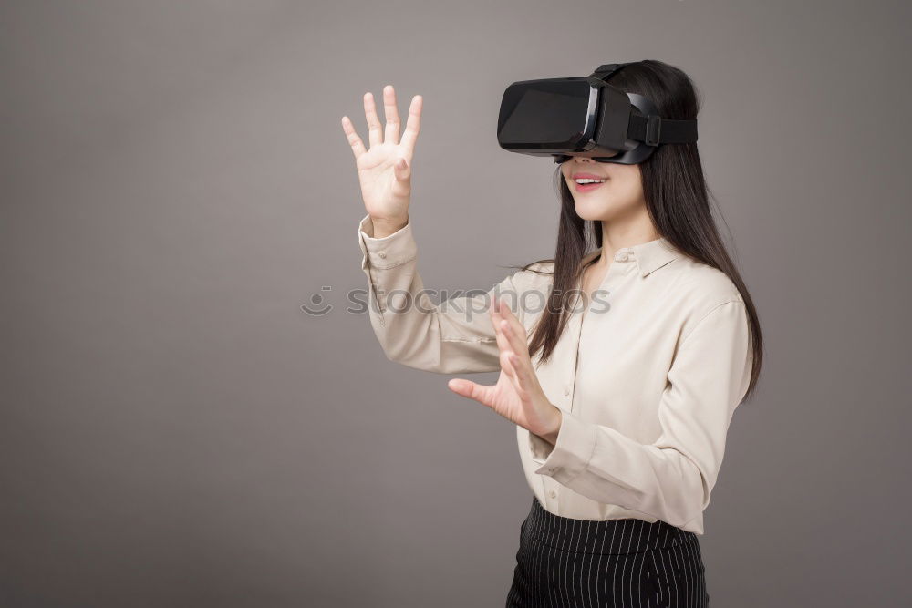 Similar – Image, Stock Photo Woman experiencing virtual reality in home