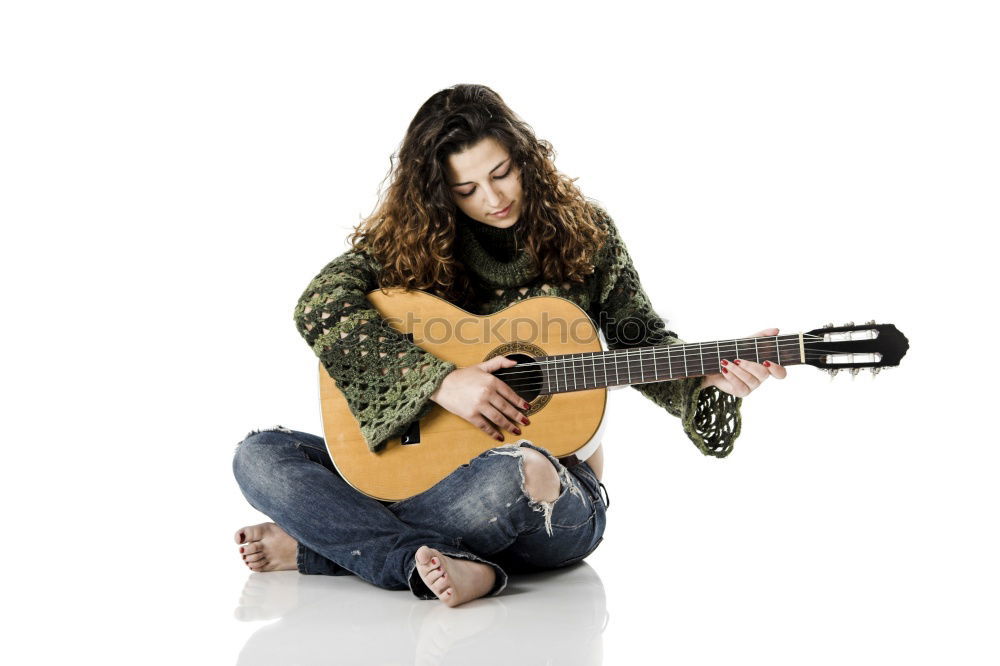 Similar – Pensive woman sitting near guitar on floor