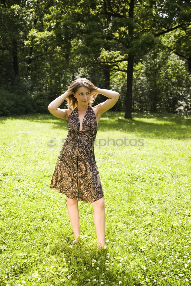 Similar – Woman with a sign in the park