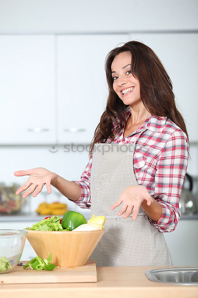 Young couple cooking. Man and woman in their kitchen