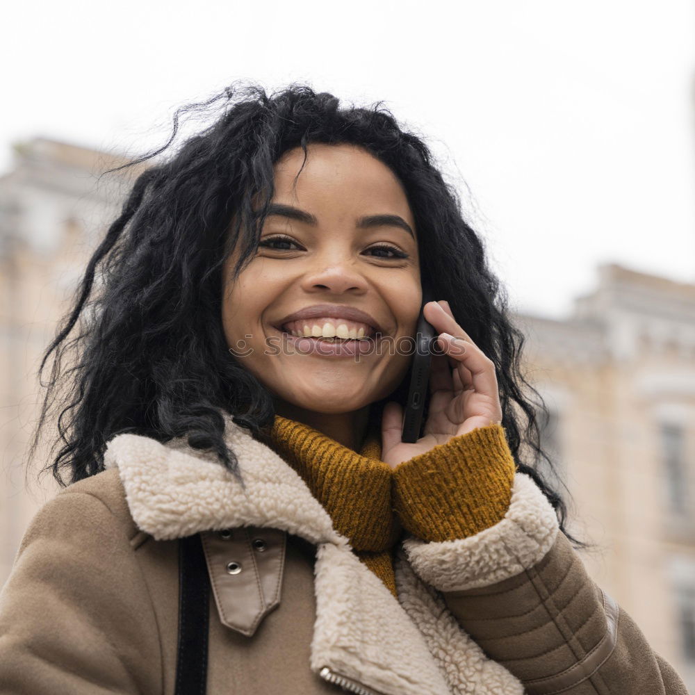 Similar – Young black woman drinking coffee wandering in the streets of Madrid on winter