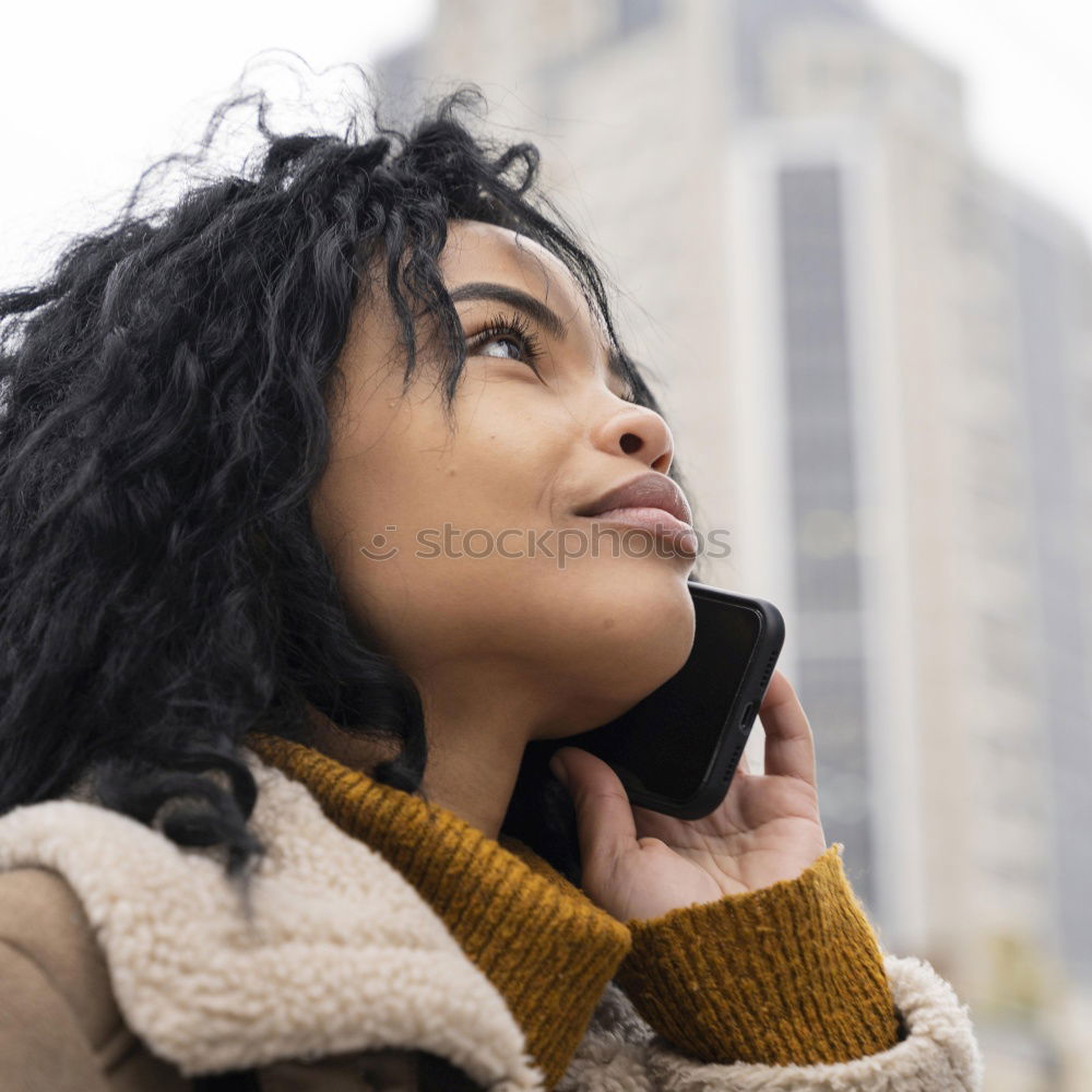 Similar – Image, Stock Photo Portrait of a cheerful young african woman standing outdoors