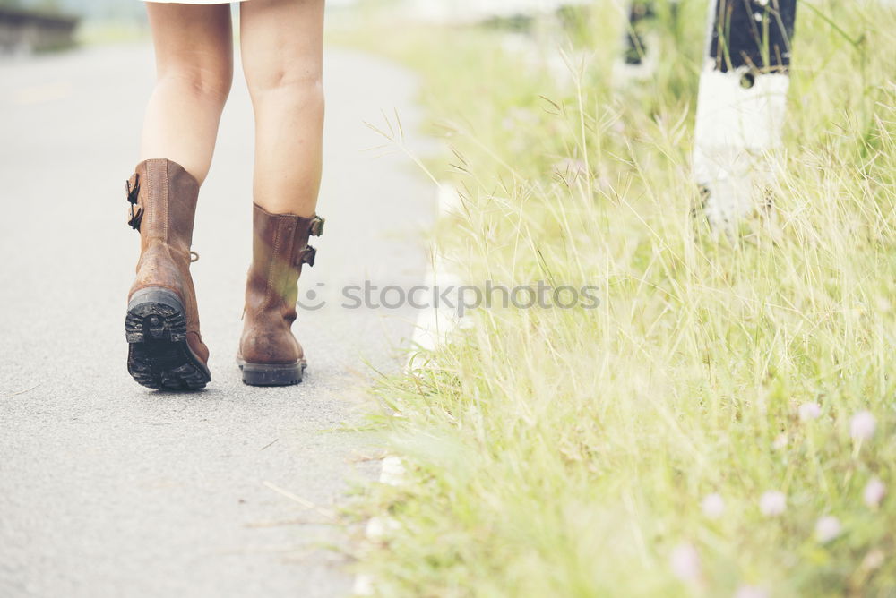 Similar – Young woman jogging down an autumn street