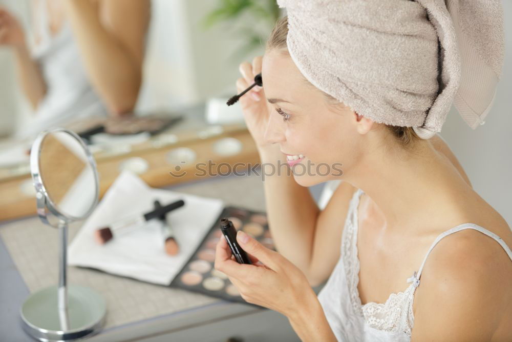 Similar – Young gender fluid person applying makeup at home