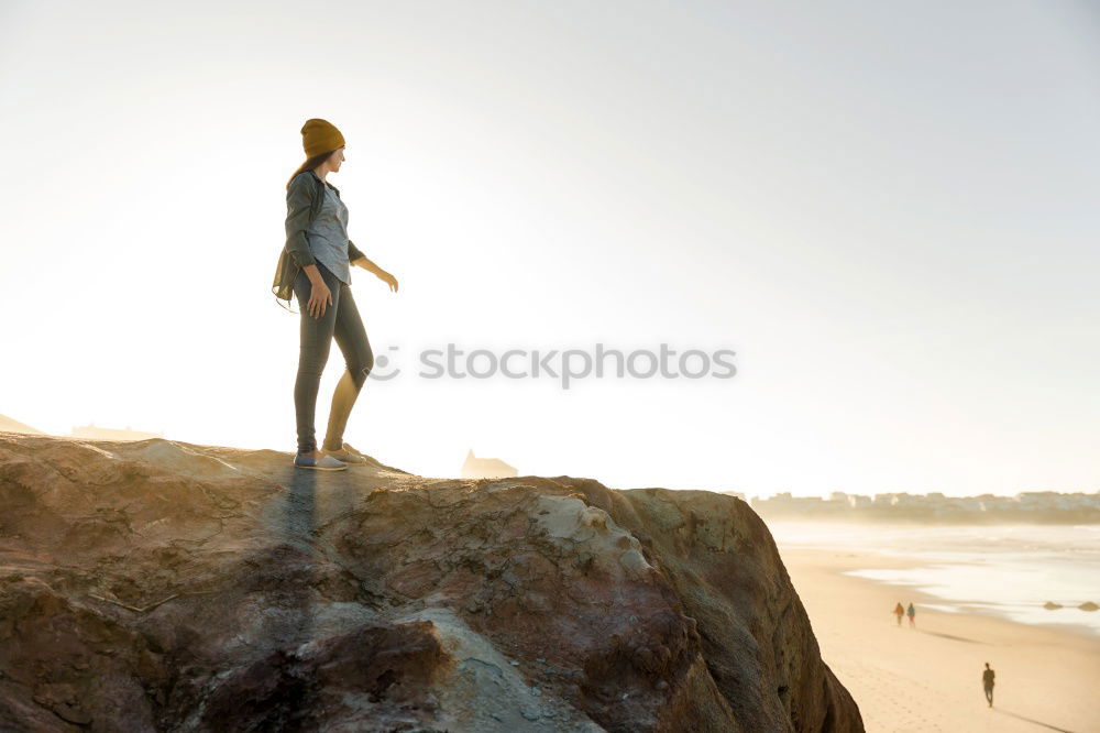 Similar – Man relaxing on cliff