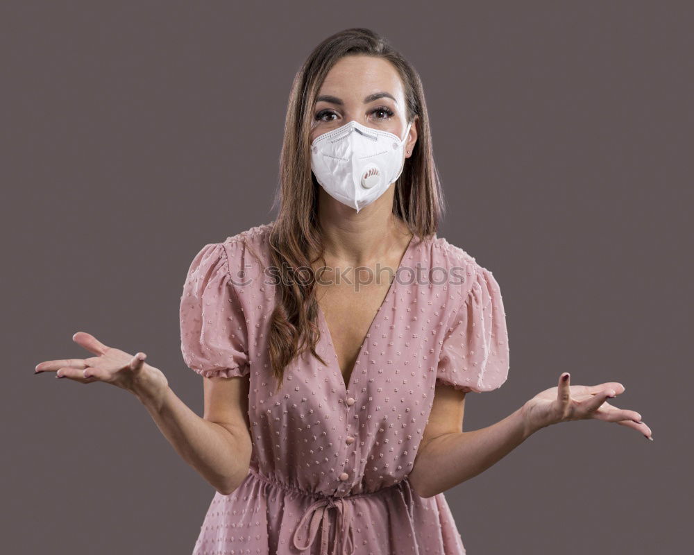 Similar – Image, Stock Photo Young pretty woman looks anxiously into the camera with wrinkled forehead and mask. Red Nose Day with funny, funny clown mask, with red bobble, pompom to protect against corona. Blonde, young, long-haired woman with cool face mask outside in the nature.