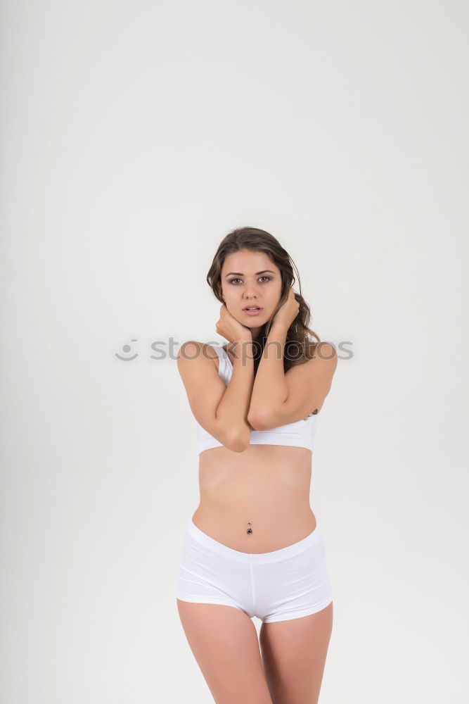 Similar – Image, Stock Photo young redhead woman with curls and freckles stands barefoot in hot pants in front of white door and smiles