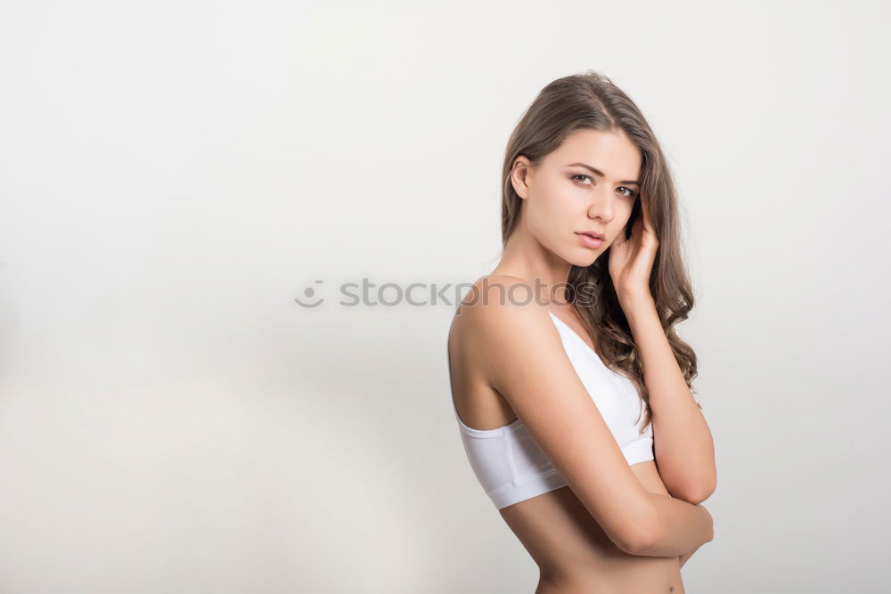 Similar – Young smiling blond woman leaning against wall