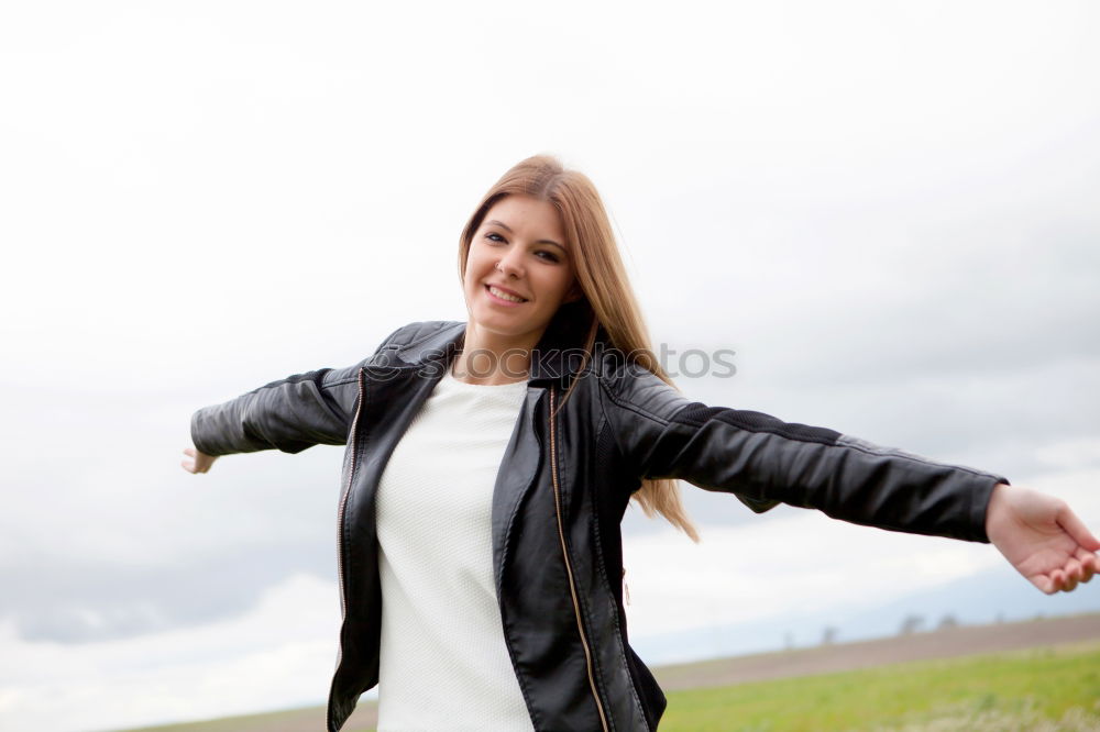 Similar – Beautiful young caucasian woman smiling outdoors