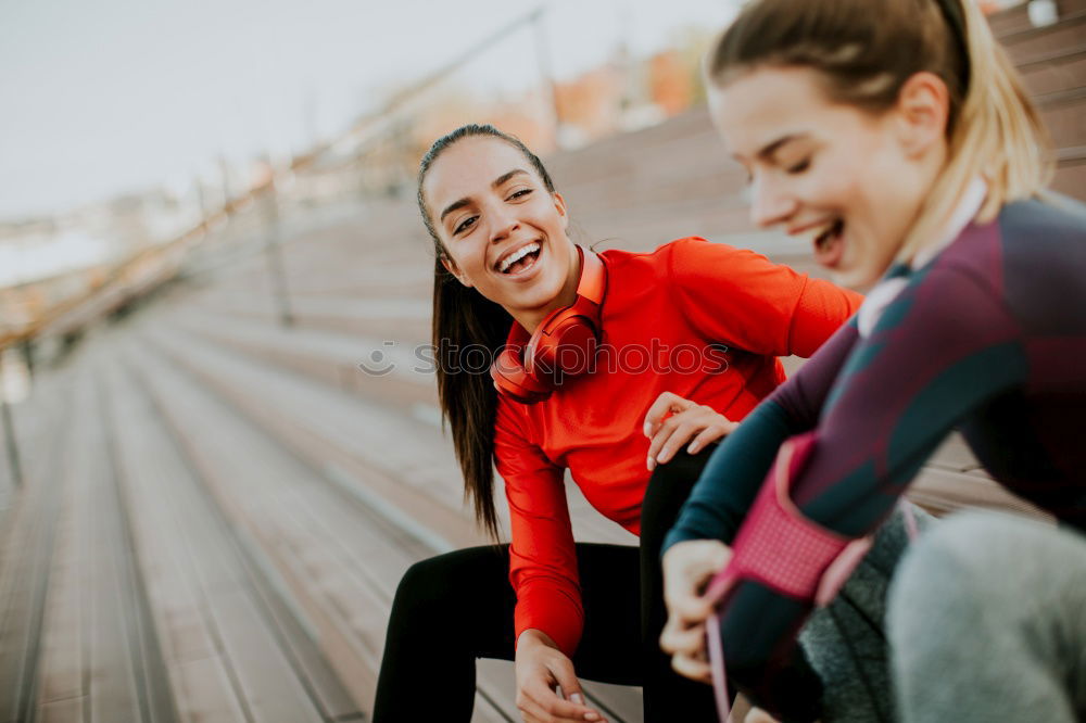 Similar – Happy friends sitting on steps