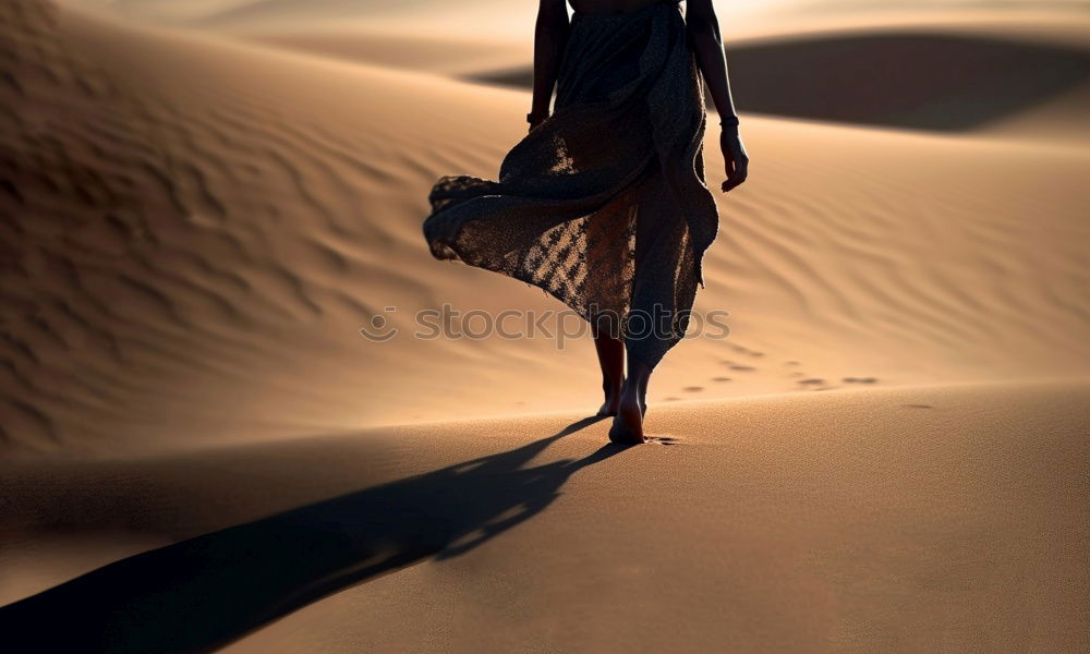 Similar – Image, Stock Photo Man sitting on a dune in the desert while watching the sunset