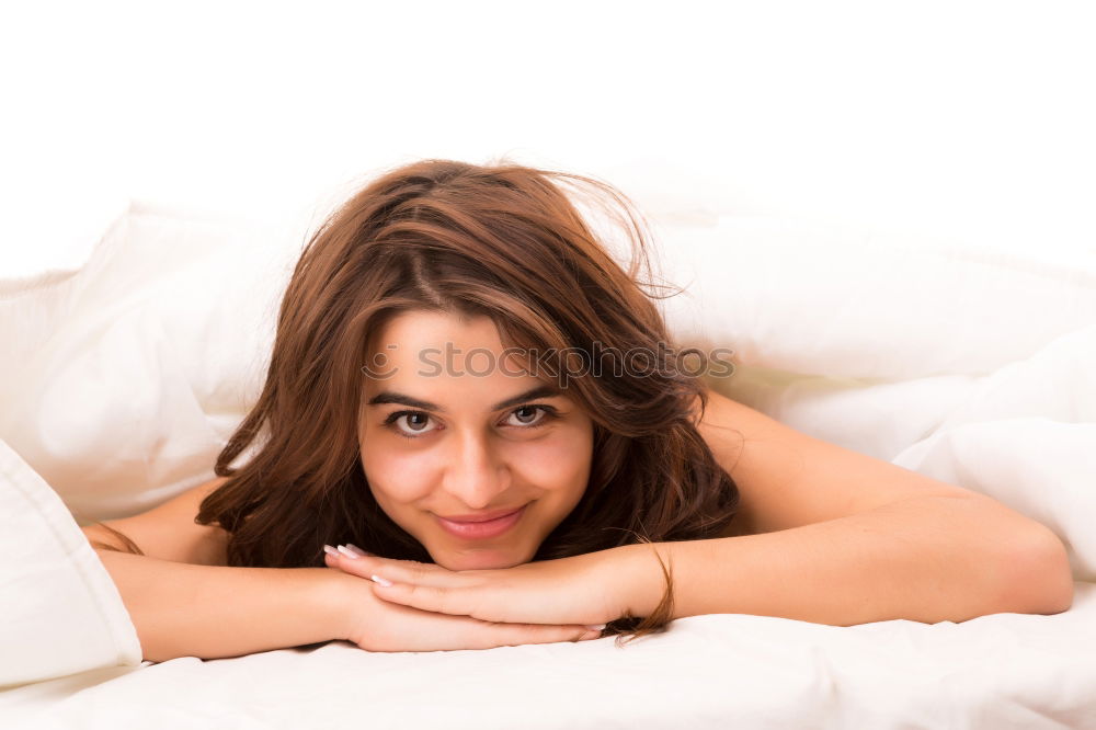 Similar – Young woman lying in bed