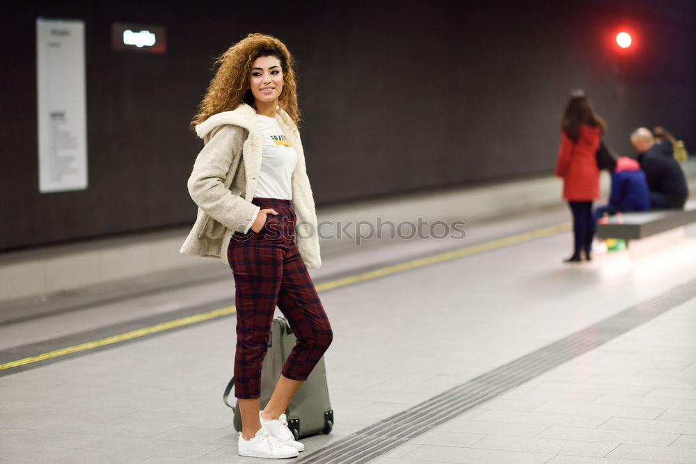 Similar – Image, Stock Photo Young Arab woman tourist waiting her train in a subway station