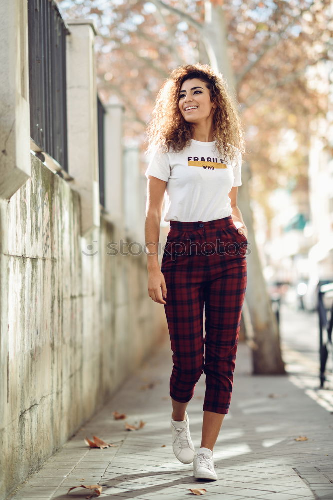 Similar – Smiling young Arab woman with black curly hairstyle