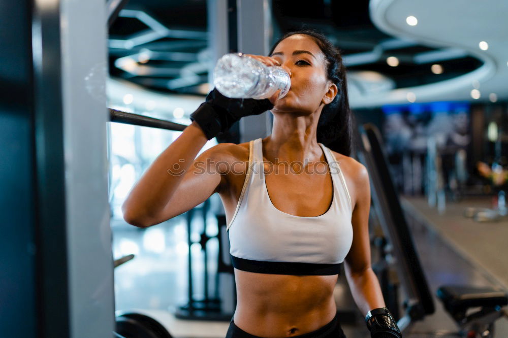 Similar – Smiling girl drinking in gym