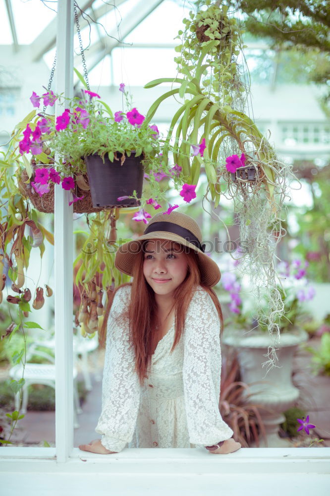 Image, Stock Photo Woman gardener, planting cactus plant in a pot