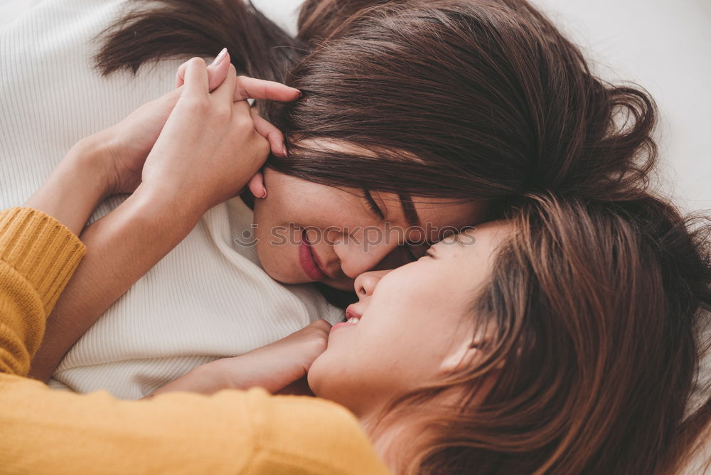 Similar – Boyfriend giving his girlfriend a kiss in the bed