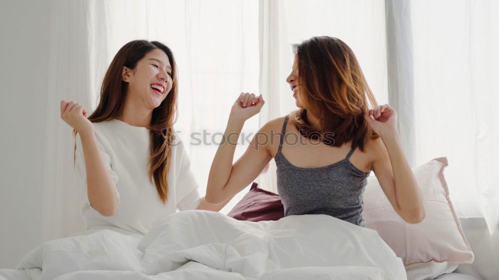 Similar – happy mother and child son playing pillow fight