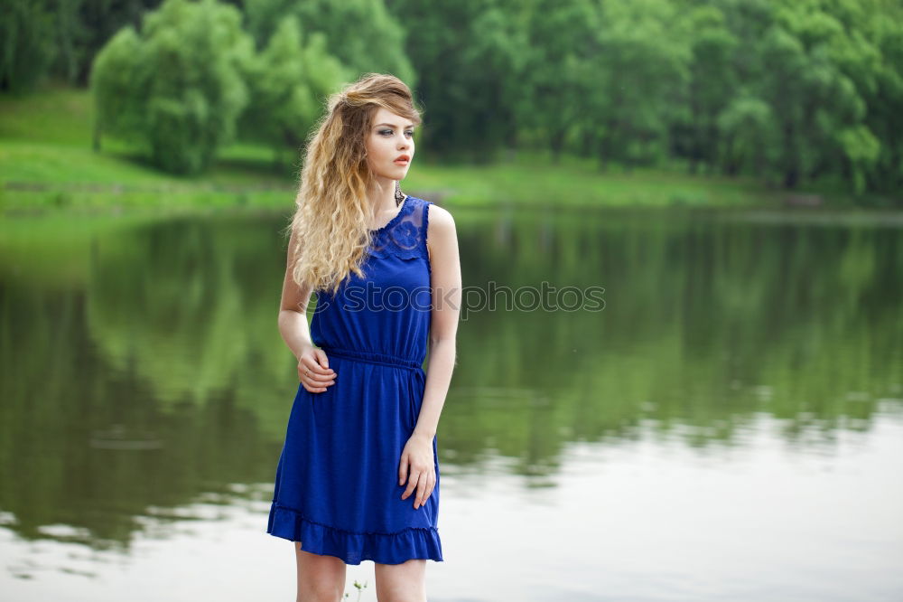 Similar – Young woman standing in the river Rhine