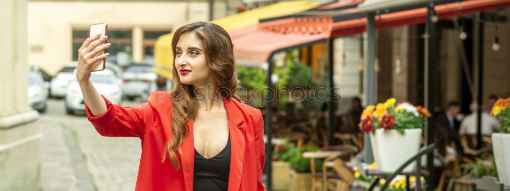 Similar – Beautiful Smiling Woman in red coat with mobile phone in hands, smartphone, urban scene