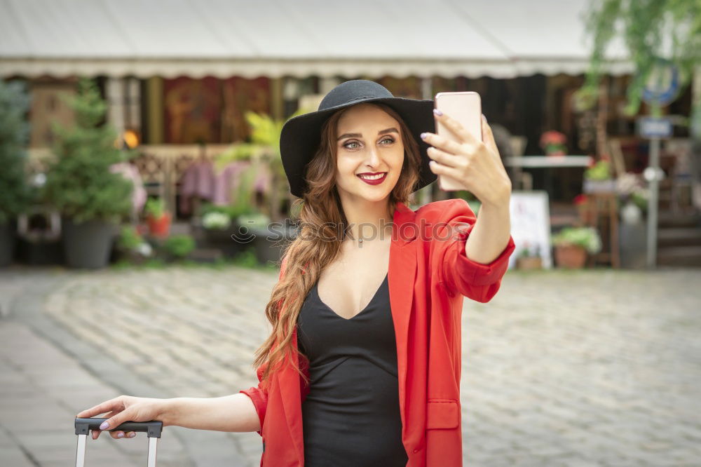 Similar – Beautiful Smiling Woman in red coat with mobile phone in hands, smartphone, urban scene