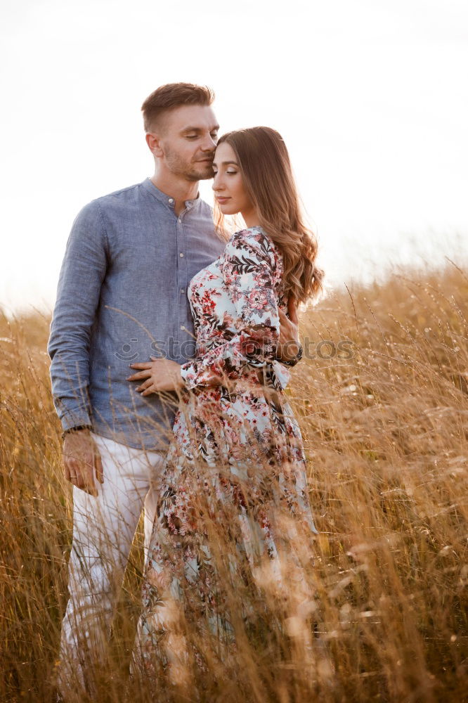 Similar – Image, Stock Photo Young loving couple kissing in the street.