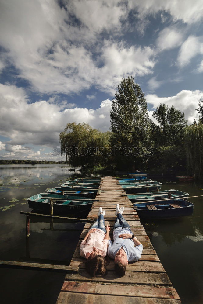 Image, Stock Photo Boy sitting on air-filled plastic crocodile in a lake