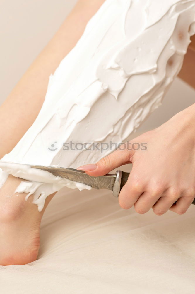 Similar – Close-up shot of a ballerina taking off the ballet shoes sitting on the floor in the studio