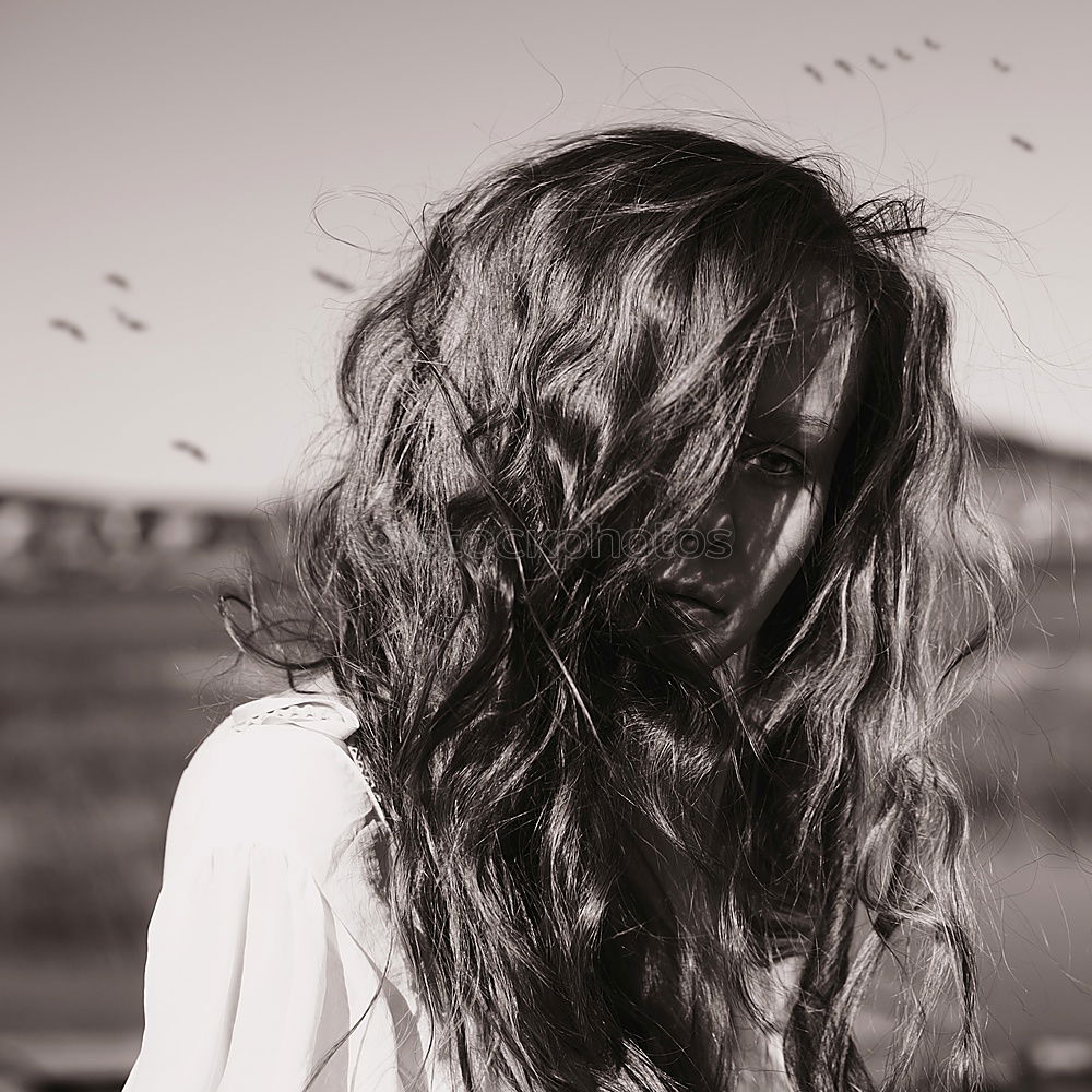 Similar – Image, Stock Photo Windy hair on face. Sunset. golden hour